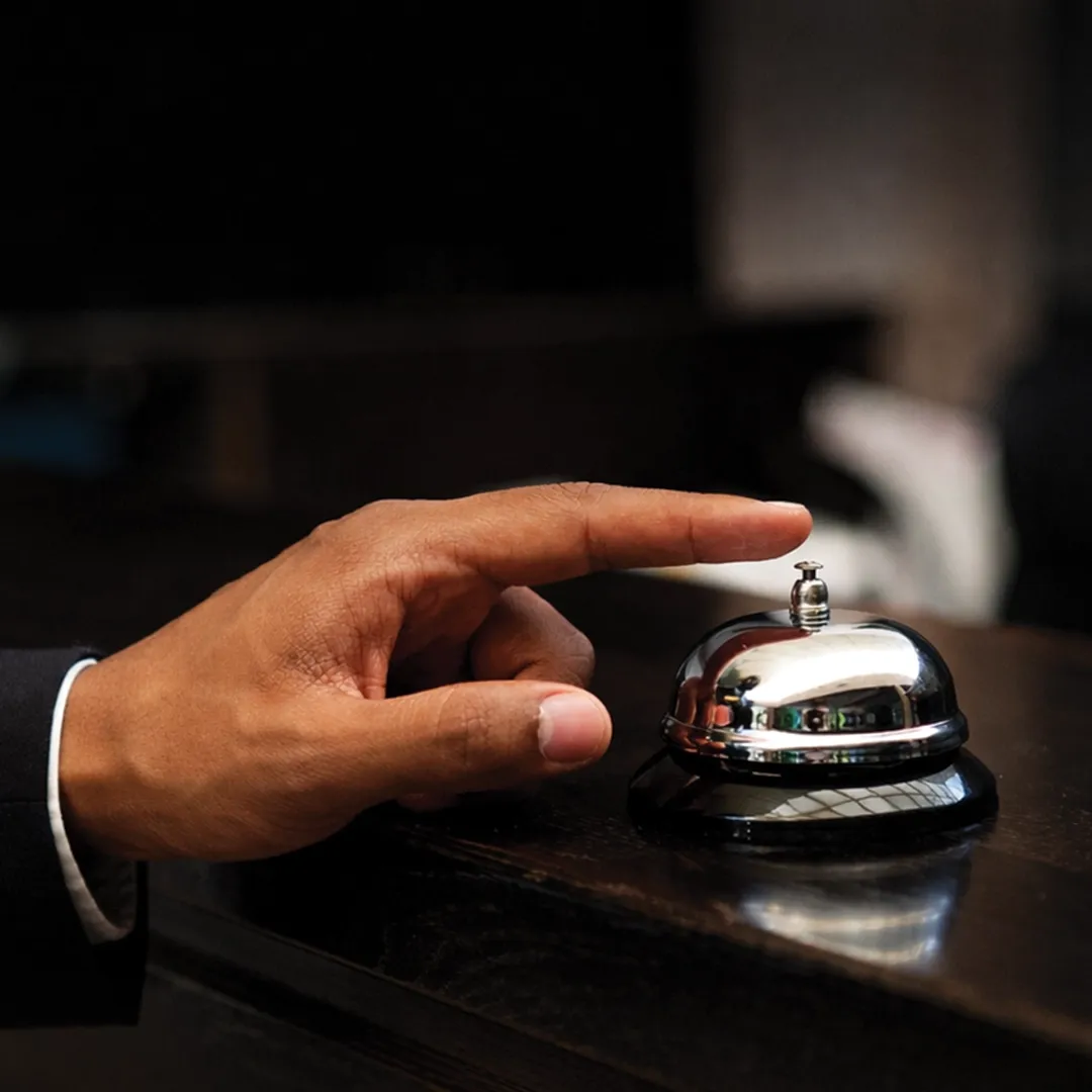 Front Desk Agent assisting guests at hotel reception