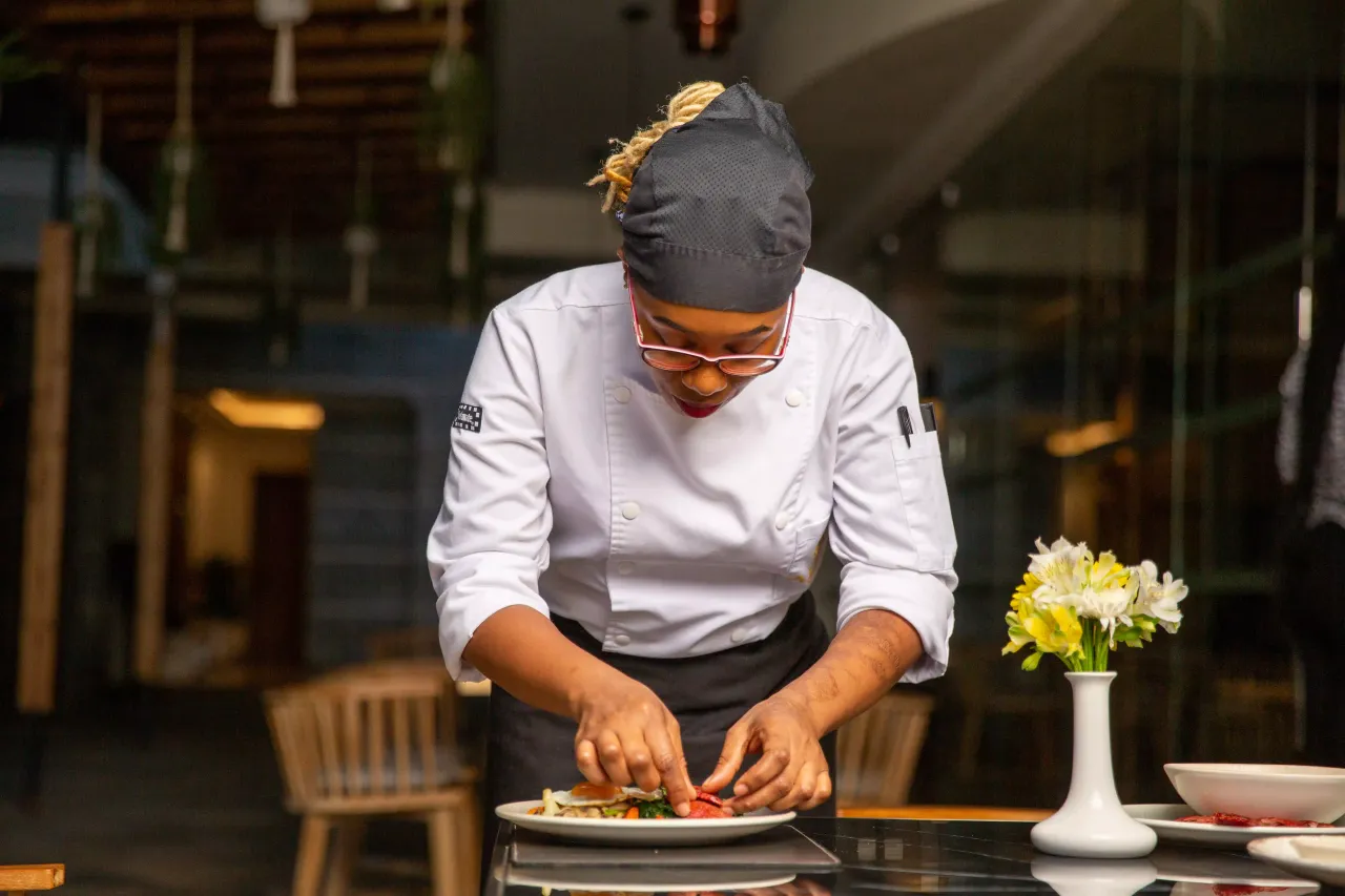 Commis Chef preparing dishes in professional kitchen